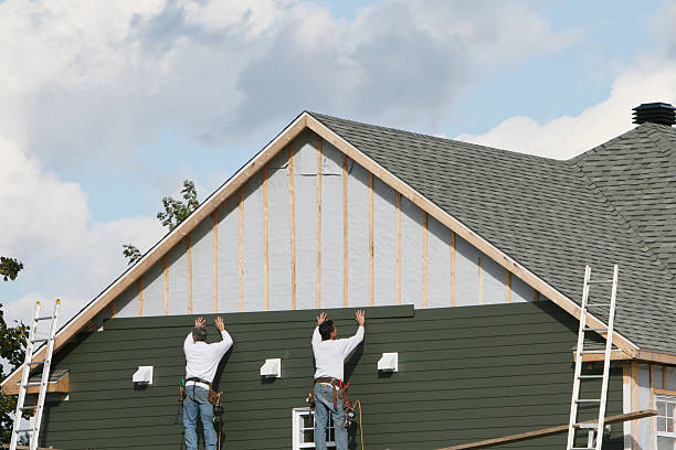 Professional Siding technician working in Acton, MA